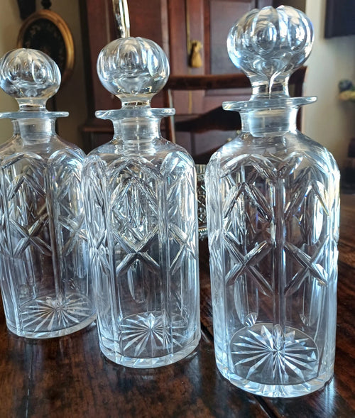Antique Silver Plate Tantalus with the original crystal decanters