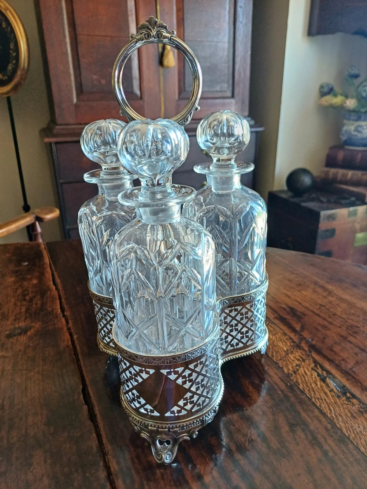 Antique Silver Plate Tantalus with the original crystal decanters