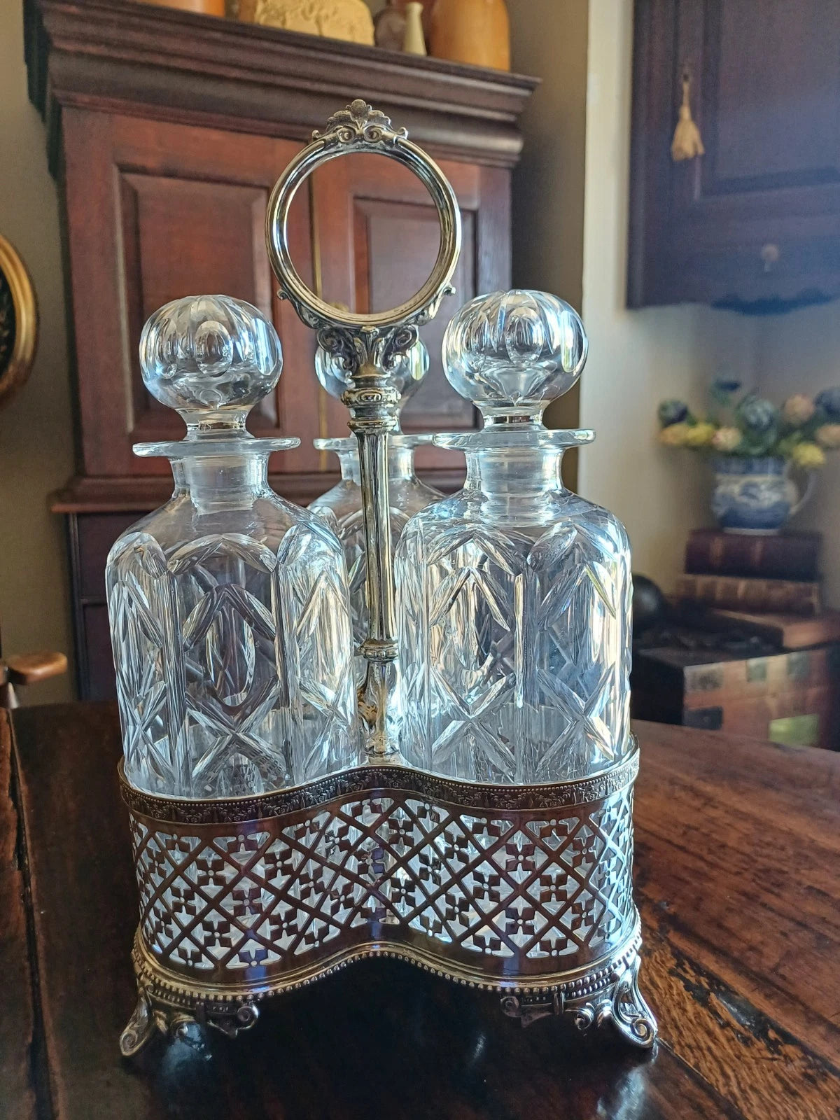 Antique Silver Plate Tantalus with the original crystal decanters